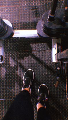 a person standing on top of a metal floor