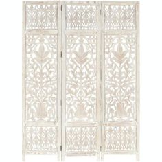 a white screen with intricate carvings on it