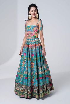 Editor's Note Hawaiian Teal Hand Embroidered Corseted Gown With SB Signature Wild Flower Print and Suede Velvet Embroidered Border. Fabric: Dupion Silk Color: Teal Care: Dry Clean Only Disclaimer: Product Color May Slightly Vary Due To Photographic Lighting Sources Or Your Monitor Setting. About the Designer Siddhartha Bansal, label epitomise its design philosophy touring around " Golden bird" nation to present day India, in the wanderlust for rich Craft and Culture presenting to the world . Vis Sleeveless Silk Dress With Resham Embroidery, Sleeveless Gown With Floral Embroidery For Reception, Floral Embroidered Maxi Dress For Reception, Silk Maxi Dress With Floral Embroidery, Floral Embroidery Maxi Dress For Reception, Reception Dress With Intricate Embroidery, Sleeveless, Sleeveless Reception Dress With Intricate Embroidery, Sleeveless Dress With Intricate Embroidery For Reception, Floor-length Floral Embroidered Summer Gown