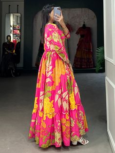 Introducing our mesmerizing pink floral printed silk festival wear gown, a stunning addition to your wardrobe for any special occasion. This fully stitched gown is made from luxurious silk fabric with intricate floral print work, making it a standout piece for festivals, events, or any function. The pink color adds a touch of femininity and elegance, while the 5-meter flair and 55-inch length create a graceful silhouette that is sure to turn heads.
When you wear this pink gown, you'll feel like Silk Saree With Digital Print, Multicolor Floral Print Kurta For Festivals, Floral Print Saree Dress For Summer, Summer Floral Print Saree Dress, Pink Floral Print Lehenga For Wedding, Silk Maxi Kurta With Floral Print, Silk Maxi Dress With Printed Motifs, Silk Kurta With Floral Print In Maxi Length, Digital Print Dress For Navratri Party