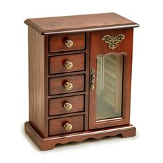 a small wooden cabinet with drawers and a mirror on the top shelf, against a white background