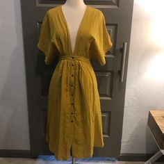 Plunging V-Neck With Button-Up Midi. Color Is A Beautiful Mustard Gold. Fabric Is Opaque, Drapes Beautifully, And Is Light Enough For A Hot Summer. Basically New Without Tags (Worn Twice) Reposhing This Item I Purchased From @Heft6129. Loved It, But Ready To Rotate For Something New. Questions? Leave A Comment Below! Summer V-neck Shirt Dress With Buttons, Summer V-neck Dress With Buttons, V-neck Shirt Dress With Button Closure For Casual Wear, V-neck Shirt Dress With Button Closure, V-neck Maxi Dress With Buttons For Daywear, V-neck Midi Dress With Button Closure For Vacation, Spring V-neck Midi Dress With Buttons, Bohemian V-neck Shirt Dress For Summer, V-neck Maxi Dress With Buttons For Date Night