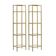 two gold metal shelvings with glass shelves