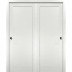 a white closet with two doors on each side