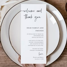 a table setting with plates and place cards on it, including a napkin that says welcome and thank you