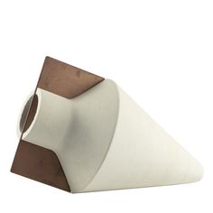 a white and brown triangle shaped object on a white background