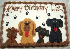 a birthday cake decorated with dogs and paw prints