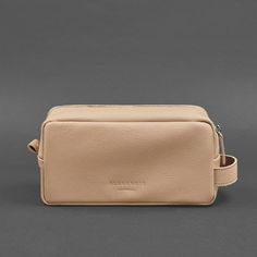 This highly convenient cosmetic bag is an excellent option for storing cosmetics, jewelry, medicines, and other small items. Its dimensions allow it to be used as a travel cosmetic bag. Inside the bag, there is one spacious compartment, and it is equipped with a comfortable handle. The rectangular shape allows for compact placement of the accessory in a bag or suitcase. The cosmetic bag closes securely with a durable zipper. Made of natural Floater leather, this high-quality leather has a grainy Modern Rectangular Pouch For On-the-go, Versatile Clutch Box Bag For Travel, Versatile Travel Clutch Box Bag, Functional Rectangular Cosmetic Bag With Zipper, Functional Rectangular Zipper Pouch Cosmetic Bag, Functional Rectangular Zipper Pouch For Cosmetics, Modern Everyday Rectangular Cosmetic Bag, Modern Rectangular Cosmetic Bag For Everyday Use, Modern Rectangular Zipper Pouch