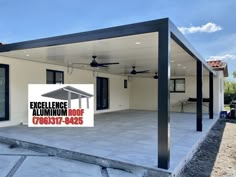 an open garage with a ceiling fan on the roof and a sign that says excellence aluminum roof