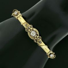 "This beautiful antique bangle bracelet was crafted from solid 14k yellow gold during the Victorian era and features a tube style with a gorgeous diamonds and seed pearls throughout its top. The fine diamonds show a nice size with the largest at the center, with all showing amazing brilliance and spectacular sparkles that are truly eye-catching on this bracelet.The stones sit on fine and open gold work designs that overlap the polished finish bracelet, adorned with adorable seed pearls throughou Antique 14k Gold Bangle, Victorian 14k Gold Bangle, Vintage 14k Stamped Gold Bangle, Victorian Gold Bracelet For Anniversary, Vintage Yellow Gold Diamond Bracelet For Weddings, Vintage 14k Gold Diamond Bracelet, Vintage Gold Diamond Bracelet, Old Mine Cut Diamond, Antique Bracelets