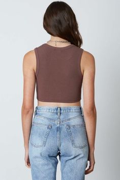 Final Sale - Get it before it's gone! Upgrade your basic wardrobe in the Next Level Chestnut Brown Cinched Cropped Tank! Soft and stretchy ribbed knit shapes a cropped tank silhouette with a crew neckline, a sleeveless bodice, and cinched detail on hem. DETAILS & CARE Rayon/Spandex. Machine wash cold. Imported. Fall Cropped Cotton Tank Top, Cropped Cotton Tank Top For Fall, Brown Cropped Cotton Tank Top, Brown Ribbed Sleeveless Crop Top, Brown Fitted Cropped Tank Top, Cropped Brown Cotton Tank Top, Fall Ribbed Cropped Tank Top, Sleeveless Ribbed Brown Crop Top, Stretch Cropped Tank Top For Fall