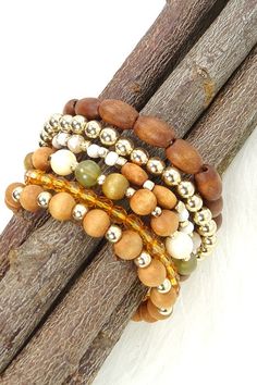 Exude bohemian flair when you wear this wooden bead stretch bracelet set. DIMENSION clasp: Stretchable metal finish: Gold Plating product: Lead & Nickle Compliant anti-tarnish: Double E-coating Bohemian Wood Beaded Bracelets, Bohemian Wood Bracelet Jewelry, Adjustable Wooden Beaded Bracelets, Bohemian Wooden Bead Bracelets, Brown Beaded Wood Bracelets, Bohemian Gold Stretch Bracelet With Wooden Beads, Bohemian Adjustable Wooden Beaded Bracelets, Adjustable Wooden Bohemian Beaded Bracelets, Bohemian Beaded Natural Wood Jewelry