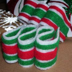 several christmas candy canes sitting on top of a table