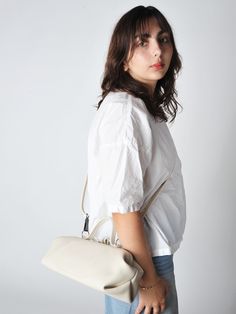 The baguette bag is a charming framed ladies bag. softly structured in a supple leather and lightweight it has a snap top closure and a detachable adjustable strap which allows for multiple carry options.    • handmade in utrecht the netherlands  • 14"l x 6"h x 5"d - unlined  • detachable adjustable shoulder strap 38" - smoke hardware  • 3.5" handles  • single snap top frame closure.  2 small drop down pockets on either side of the bag  • exclusive to roztayger in the us Womens Designer Bags, Ladies Bag, Baguette Bag, Shoe Gifts, Utrecht, Shoulder Tote, Sock Shoes, Sale Design, Cloth Bags