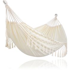 a white hammock with tassels hanging from it's side on a white background