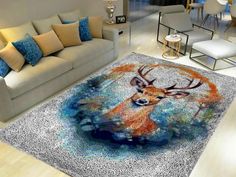 a living room area with couches, chairs and a rug on the floor that has a deer's head painted on it