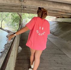 SUPER cute hot pink smiley face tee! The shirts are Gildan 64000 - Softstyle® T-Shirt, super soft, comfortable, lightweight material. I recommend sizing up if you want an oversized fit like in the pictures. These tees are perfect for this summer at the beach, pool, or lake. If you have any questions please reach out! - PROCESSING TIME - The processing time is 1-2 weeks because these t-shirts are made to order so when I receive your order I will then place an order for the blank t-shirt, once I receive it I will add the design and it will be on the way to you! - SIZES - All sweatshirts are unisex sizes ranging from a small to 2XL! - CARE INSTRUCTIONS - Every order will come with a care card with instructions and tips to keep your t-shirt looking its best, so make sure to follow the instruct Trendy Smiley Face Tops For Loungewear, Trendy Smiley Face Loungewear Tops, Relaxed Fit Smiley Face Top For Loungewear, Smiley Face Top For Loungewear, Comfortable Short Sleeve T-shirt For Day Out, Cute Pink Smiley Face Top, Casual Smiley Face Top, Comfortable Crew Neck T-shirt For Day Out, Relaxed Fit Pink T-shirt For Day Out