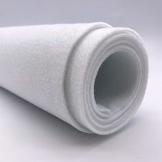 a roll of white felt sitting on top of a table