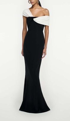 Make a Showstopping Entrance in This Dramatic Black Maxi Dress With an Asymmetric Off-The-Shoulder Ruffle Neckline. The Breezy Chiffon Skirt Sways Hypnotically as You Dance, While the Slim Bodice Hugs Your Shape. Accentuate the Waist With a Belt. Step Into the Spotlight and Let This Bold Maxi Dress Do the Talking Wherever You Go. Fitted bodice and fluted hem Fabric twist at bodice Internal corset Zip fastening at side Fully lined bodice Skirt unlined Main Fabric: 97% Viscose, 3% Elastane Contras Luxury Asymmetrical Neckline Midi Dress For Dinner, Luxury Asymmetrical Hem Midi Dress For Gala, Luxury Asymmetrical Dress With Asymmetrical Neckline For Dinner, Luxury Asymmetrical Dress For Evening With Fitted Bodice, Luxury Banquet Gown With Asymmetrical Neckline, Luxury Dress With Asymmetrical Neckline For Banquet, Luxury Gown With Asymmetrical Neckline For Banquet, Luxury Glamorous Dress With Asymmetrical Neckline, Luxury Elegant Maxi Dress With Cut-out Waist