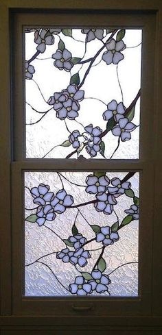 two stained glass windows with flowers on them