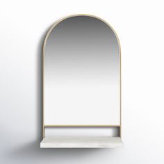 a white shelf with a mirror on it