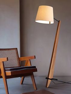 a lamp that is next to a chair