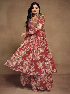 Indulge in the timeless allure of our ravishing red chiffon suit, adorned with exquisite floral print, zari work, and sequin detailing. This ensemble encapsulates the essence of elegance and sophistication, with its vibrant red hue and delicate embellishments. Crafted from high-quality chiffon material, it offers a luxurious feel and a flattering drape, ensuring both comfort and style.
Accompanying this stunning suit is a matching chiffon palazzo, intricately designed with floral print work to c Wedding Sharara With Printed Motifs In Georgette, Wedding Sharara With Printed Motifs, Designer Floral Print Georgette Sharara, Designer Floral Print Sharara In Georgette, Red Georgette Palazzo Set For Party, Elegant Red Floor-length Palazzo Set, Wedding Palazzo Set In Georgette With Printed Motifs, Red Georgette Palazzo Set For Festivals, Elegant Semi-stitched Red Palazzo Set