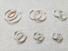 14K Gold Filled Hoop Earrings, Plain hoop snap post gold filled earrings, Classic everyday light weight hoop earrings, stacking hoops, Round Tube Gold Filled, Round Click Hoop Earrings 14K Gold Filled Hoop Earrings - 2.2mm - 12mm 14K Gold Filled Hoop Earrings - 2.2mm - 15mm 14K Gold Filled Hoop Earrings - 2.2mm - 18mm 14K Gold Filled Hoop Earrings - 2.2mm - 22mm 14K Gold Filled Hoop Earrings - 2.2mm - 34mm 14K Rose Gold Filled Hoop Earrings: https://www.etsy.com/listing/1014219384/14k-rose-gold- Adjustable Stackable Hoop Earrings For Everyday, Classic Round Stackable Hoop Earrings, Adjustable Stackable Earrings For Everyday, Everyday Adjustable Stackable Earrings, Silver Stackable Hoop Earrings For Everyday, Silver Huggie Hoop Earrings Stackable, Small Hoop Stackable Earrings As Gift, Silver Stackable Hoop Earrings, Silver Stackable Hoop Earrings As Gift