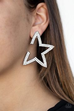 Encrusted in two rows of glassy white rhinestones, a gunmetal star frame dots the ear for a stellar shimmer. To flatter the natural contour of the face, one side angle of the star frame is intentionally left open. Earring attaches to a standard post fitting. Side Angle, Natural Contour, Crystal Stars, Paparazzi Accessories, White Rhinestone, Black Earrings, Paparazzi Jewelry, Affordable Jewelry, Black Star