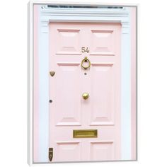 a pink door with gold handles and knobs