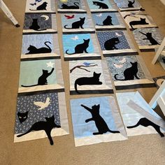 the cat quilts are laid out on the floor