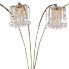 two metal and glass flower vases with beaded flowers on each side, set against a white background