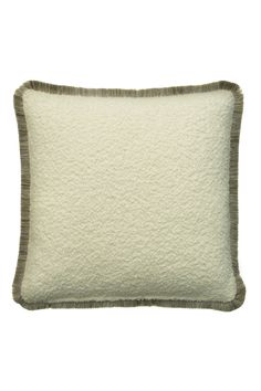 a white pillow with brown trim on the side and a gray border around it,