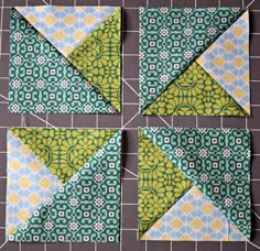 four square blocks with green and yellow designs on the top, one is folded in half