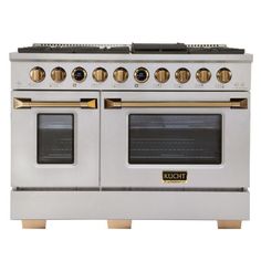 a silver and gold stove with two ovens