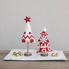 three wooden christmas trees on a table