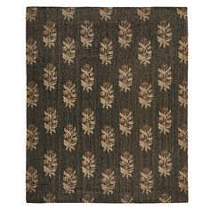 a brown rug with leaves on it