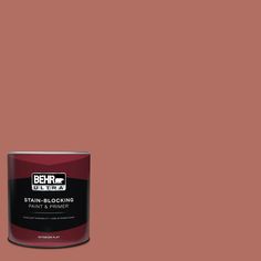 a can of behrut ultra stain - blocking paint on a pink background,