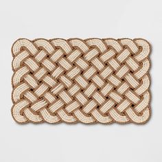 a woven placemat on a white surface