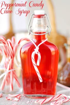 peppermint candy cane syrup in a glass bottle on a table with candies