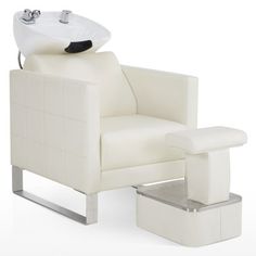 a white chair and foot stool with a bowl on top of it, in front of a white background