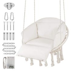 a white swing chair hanging from a rope with hooks and clips attached to the seat