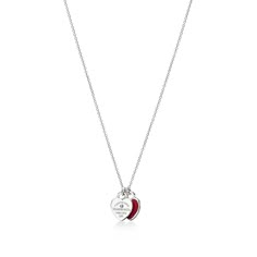 Inspired by a key ring we debuted in 1969, the Return to Tiffany collection is famous for its signature motif. This sterling silver pendant features a pair of the iconic mini heart tags suspended from a fine link chain. One tag is set with a round brilliant diamond; the other tag features a red enamel finish for a playful pop of color. Style with other delicate necklaces or contrast with bold chain jewelry for an unexpected look.This item can be personalized. For more information, call 800 843 3 Tiffany Double Heart Necklace Red, Red Heart Tiffany Necklace, Tiffany Red Heart Necklace, Red Tiffany Necklace, Tiffany & Co, Colar Tiffany E Co, Tiffany Heart Necklace, Return To Tiffany Necklace, Heart Necklace Tiffany