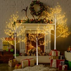 a fireplace decorated with christmas lights and presents