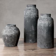 Artisanal gray earthenware vessel with weathered patina on wood floor with gray background. Tall Stone Vase, Distressed Ceramic Vase, Pottery Black Vase Large, Grey Stone Vase, Wabi Sabi Vase Pottery, Clay Vases, Earthy Home Decor, Faux Branches, Grey Vases