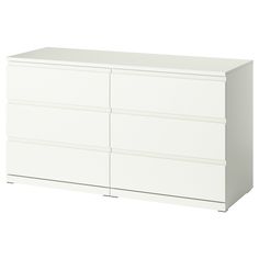 a white dresser with four drawers and two doors