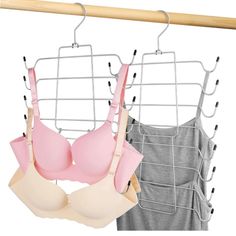 two bras hanging on a clothes rack