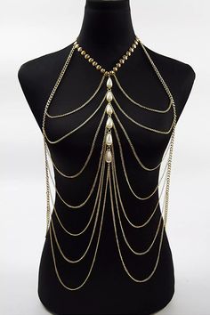 Stay hot this summer in the Adelynn Bikini Tassel Pearl Body Chain. This layered statement necklace features a gold-tone metal link base, drapey chain, and layered bib silhouette. Delicate pearls accent the center. It can be worn with a top tube dress or a bikini as an outfit. A summer body chain with a perfect sense of fashion, why not try it?  One Size fits all  Colour may vary due to lighting on images Bralette Chain, Pearl Body Chain, Punk Summer, Gold Body Chain, Gold Bodies, Gold Bead Necklace, Party Summer, Layered Chains, Chain Fashion