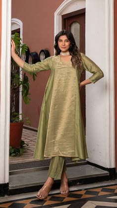 Green Golden Tissue Chanderi Anarkali Kurta Set, Kurta pant set Anarkali dresses, Indian wedding outfit Bring on the festive spirit with our anarkali kurta set in pure tissue and chanderi silk. Panelled Anarkali Kurta with separate inner and matching cotton silk pants. Kurta Fabric : Pure Tissue + Chanderi Silk. Pants : Cotton Silk. Dupatta : Pure Tissue. Colour : Light Green. Model height is 5.6" and is wearing a size S. Wash Care : Dry Clean Only. This product will be exclusively handcrafted f Pista Green Chanderi Floor-length Kurta, Pista Green Floor-length Chanderi Kurta, Floor-length Pista Green Chanderi Kurta, Pista Green Slub Silk Anarkali Set With Resham Embroidery, Chanderi Anarkali Palazzo Set For Festivals, Anarkali Style Pista Green Raw Silk Sharara, Tissue Kurta Design, Festival Chanderi Palazzo Set, Pista Green Semi-stitched Slub Silk Anarkali Set