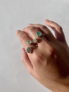 The seaglass is handpicked from southwest coastlines England. The seaglass for your ring is roughly 5mm-8mm, The band of your sea glass ring  is 1.5mm wide, making it very light and comfortable to wear daily.  The ring size is adjustable, the sizing is very flexible. Small one can fit from size H - O, and the bigger one can fit O to Z.  All the seaglass colour and size are randomly selected, if you require a specific colour please let me know, I will do my best to accommodate with what I have in Handmade Adjustable Sea Glass Rings, Adjustable Sea Glass Ring Jewelry, Handmade Sea Glass Ring Jewelry, Silversmithing Jewelry, Sea Glass Ring, Ocean Jewelry, Glass Ring, How To Make Rings, Jewellery Handmade